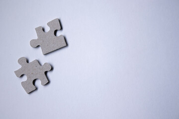 Obraz premium gray puzzles on a white background. isolated. Top view, copy space. . High quality photo