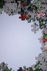 multicoloured puzzles on a white background. isolated. Top view, copy space. . High quality photo
