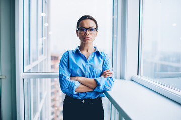 Young attractive brunette woman in office interior