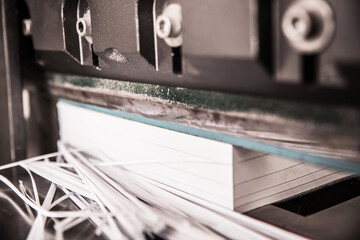 The paper cutter is working.