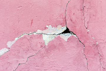 Abstract background concrete painted pink paint, weathered with cracks and scratches. Landscape style. Grungy Concrete Surface. Great background or texture