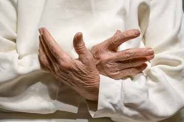 Hands of an elderly woman close up.