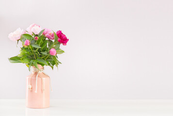 
Bouquet of flowers in a vase on a white table