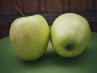 green apples on wooden table