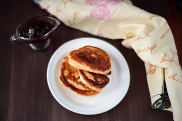 Pancakes with jam. Photo of a glass of tea and pancakes.