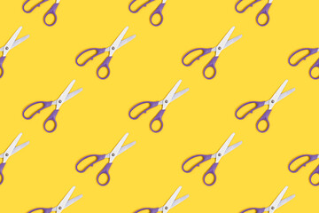 Scissors pattern on a yellow background. Office supplies layout.