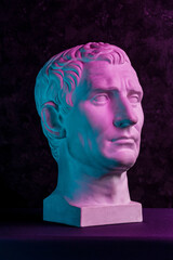 Statue of Guy Julius Caesar Octavian Augustus. Creative concept colorful neon image with ancient...