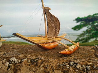toy boat on the beach