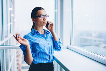 Young attractive brunette woman in office interior