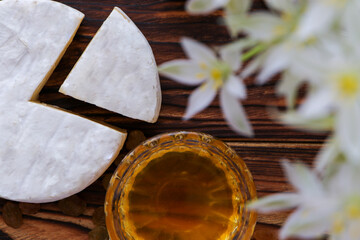 Camembert cheese close-up on a wooden background