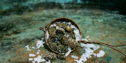 Salted capers in the strainer