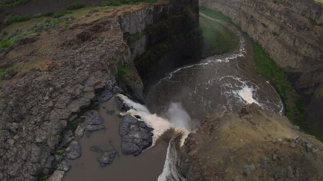 Drone Flying Over Waterfall Cliff Edge to Big Canyon Drop
