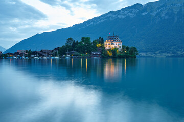Obraz premium Evening panorama of Iseltwald and Lake Brienz (Brienzersee), Bernese Oberland region of Switzerland 