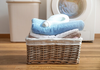 Wicker laundry basket with clean bath towels