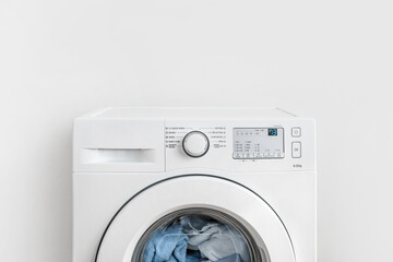 Working washing machine on white background