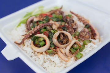 Thai food. Pad Kra Pao. Stir Thai holy basil Fried squid pour rice very spicy flavor