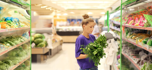 Woman buying vegetables at the market	