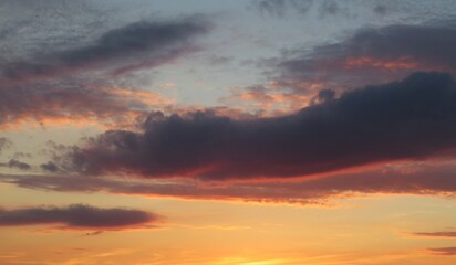 Beautiful orange sunset view with dark burgundy clouds