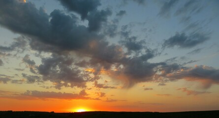 Beautiful orange sunset view over the field, natural background