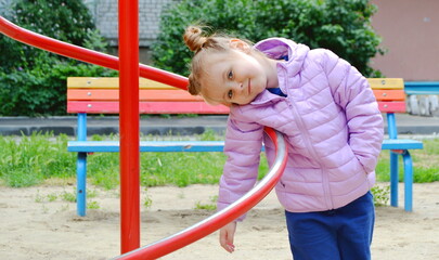 little girl playing on playground