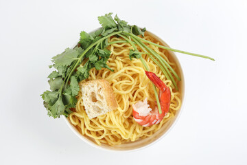 Fresh yellow egg noodle prawn tofu coriander leaf in bowl on whit background