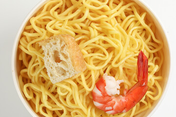 Fresh yellow egg noodle prawn tofu in bowl on whit background