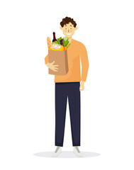Fototapeta na wymiar Young white happy adult man holding paper bag with grocery purchases