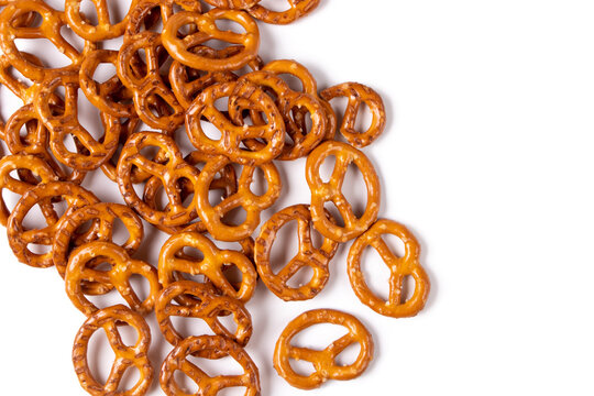 Salt pretzels isolated on white background. Salty snacks. Top view. Closeup.