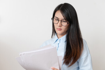 Worried businesswoman reading paper Earnings report on white background.
