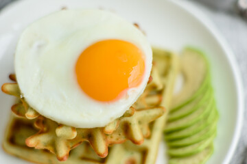Fresh delicious and nutritious breakfast with waffles with spinach