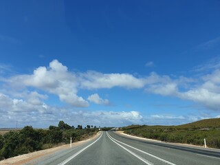 Road in highway with blus sky and cloud in background