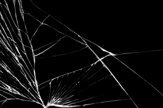Black cracked Touch Screen Phone. Cracks and scratches on the surface. Abstract broken glass background or texture