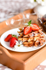 Delicious fresh baked belgian waffles with berries and fruit