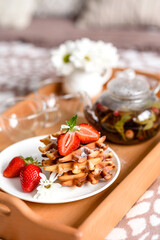 Delicious fresh baked belgian waffles with berries and fruit