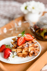 Delicious fresh baked belgian waffles with berries and fruit