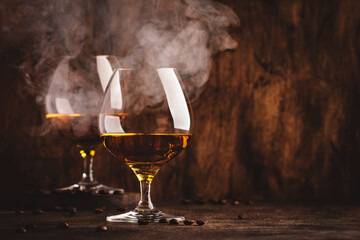 Armagnac, French grape brandy, strong alcoholic drink. Still life in vintage style with cigar...