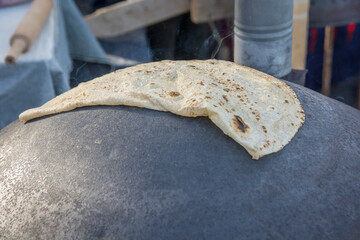 Traditional Druze Pita bread, baked on a Saj or Tava, on open fire