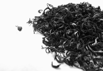 Dry tea isolated on white with blur effect in black and white.