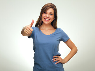 Fototapeta premium smiling woman doing thumb up. isolated female portrai