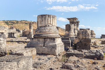 Fototapeta na wymiar Remains of columns in ruins of the Greek - Roman city of the 3rd century BC - the 8th century AD Hippus - Susita on the Golan Heights near the Sea of Galilee - Kineret, Israel