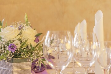 Premium dinner gala with flowers napkins and glasses in row. High class arrangement for e.g. a...