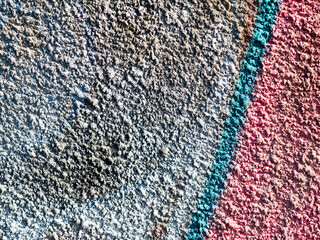 Hooligan smeared paint the walls of the old building. Landscape style. Grungy concrete surface with...