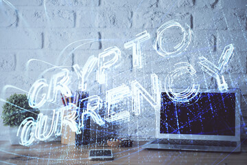 Multi exposure of blockchain and crypto economy theme hologram and table with computer background....