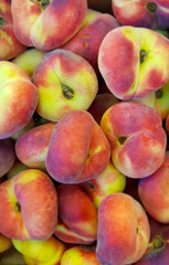 Saturn peaches on display at market.