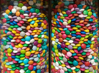 Colourful sweets and candy in glass tube display.