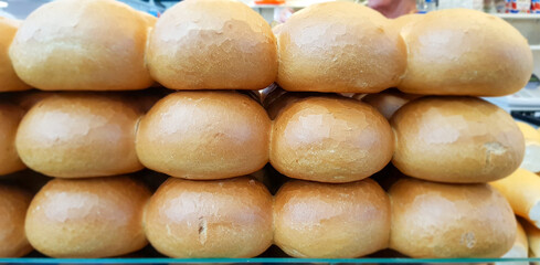 White bread rolls at open market.