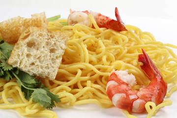 Fresh yellow egg noodle prawn tofu coriander leaf on whit background