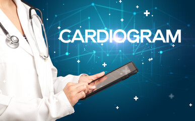 Doctor fills out medical record with CARDIOGRAM inscription, medical concept