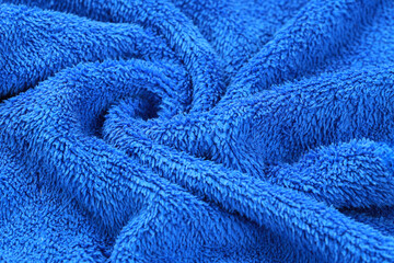 Blue fabric textile texture macro background. Selective focus image.