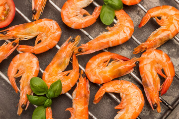 Tiger shrimps on metal grill close up.